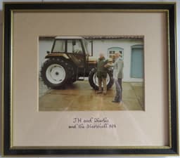 Jospeh and Charles Nickerson by a tractor
