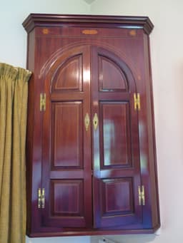 Floating wooden corner cabinet